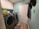 Laundry room with modern washer and dryer, and ample cabinet space at 3108 Robins Nest Way, Myrtle Beach, SC 29579