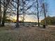 Community picnic area with tables, pond, and serene sunset at 3108 Robins Nest Way, Myrtle Beach, SC 29579