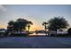 Scenic view of community pond with sunset and landscaping at 3108 Robins Nest Way, Myrtle Beach, SC 29579