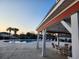 Poolside patio with ample seating, a view, and cover from the sun at 3108 Robins Nest Way, Myrtle Beach, SC 29579