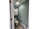 Small toilet room with white cabinet and grey walls at 3108 Robins Nest Way, Myrtle Beach, SC 29579