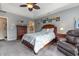 Bedroom featuring grey walls, crown molding, and wood dresser at 3178 River Bluff Ln., Little River, SC 29566