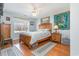 Comfortable bedroom featuring a ceiling fan, wood floors, and a cozy rug at 3178 River Bluff Ln., Little River, SC 29566