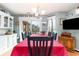 Cozy dining room featuring a large table, cabinets, and decorations at 3178 River Bluff Ln., Little River, SC 29566