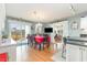 Bright dining room features hardwood floors, neutral walls, and access to outdoor deck area at 3178 River Bluff Ln., Little River, SC 29566