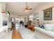 Spacious living room featuring hardwood floors, a fireplace, and lots of natural light at 3178 River Bluff Ln., Little River, SC 29566