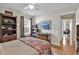 Bedroom features wood floors, bookcase, dresser, and natural light at 322 Crooked Oak Dr., Pawleys Island, SC 29585