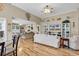 Bright open living space with views into dining area and other living spaces with hardwood flooring at 322 Crooked Oak Dr., Pawleys Island, SC 29585