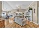 Open living space with hardwood flooring, vaulted ceilings, and views into the adjacent dining area at 322 Crooked Oak Dr., Pawleys Island, SC 29585