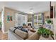 Cozy living area with french doors, fireplace, and large window providing ample natural light at 322 Crooked Oak Dr., Pawleys Island, SC 29585