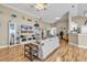 Inviting living room featuring hardwood floors, neutral paint, and seamless transition to dining at 322 Crooked Oak Dr., Pawleys Island, SC 29585