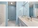 Well-lit bathroom featuring tile floors, vanity with sink, and a combination tub and shower at 3471 Spivey St., Loris, SC 29569