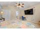 Bedroom featuring a mounted TV, a ceiling fan and a desk with chair at 3471 Spivey St., Loris, SC 29569