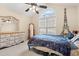 Bright bedroom featuring a dresser, an arched window, and a ceiling fan at 3471 Spivey St., Loris, SC 29569