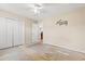 Bedroom with ceiling fan, closet, and playful decal; needs flooring and some TLC at 3471 Spivey St., Loris, SC 29569