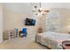 Bedroom featuring an arched window, desk with chair, and a ceiling fan at 3471 Spivey St., Loris, SC 29569