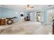 Spacious living room featuring a ceiling fan, light blue walls, and laminate flooring at 3471 Spivey St., Loris, SC 29569