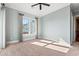 Bright bedroom featuring neutral walls, carpet, a ceiling fan and natural light from a window at 3567 Marion Ln., Murrells Inlet, SC 29576