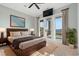 Well-lit bedroom featuring a king size bed with access to a private balcony and stunning water views at 3567 Marion Ln., Murrells Inlet, SC 29576