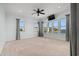 Large bedroom with neutral colored walls, a ceiling fan, and multiple windows offering waterfront views at 3567 Marion Ln., Murrells Inlet, SC 29576