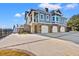 Spacious four-car garage with an elevated two-story residential structure at 3567 Marion Ln., Murrells Inlet, SC 29576