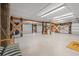 Spacious garage with high ceilings, support beams, and epoxy flooring at 3567 Marion Ln., Murrells Inlet, SC 29576
