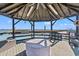Interior view of a gazebo featuring ample seating and waterfront views at 3567 Marion Ln., Murrells Inlet, SC 29576