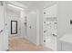 Hallway with closet, carpet, and entry to bedroom and bathroom at 3567 Marion Ln., Murrells Inlet, SC 29576