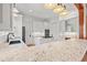 Modern kitchen with white cabinets, granite countertops, and stainless steel appliances at 3567 Marion Ln., Murrells Inlet, SC 29576