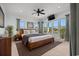 Inviting main bedroom with large windows and a ceiling fan, offering ample natural light at 3567 Marion Ln., Murrells Inlet, SC 29576
