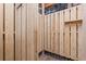 An outdoor shower with wood paneling and shelf on a tiled floor at 3567 Marion Ln., Murrells Inlet, SC 29576