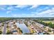 An aerial view of a neighborhood with a serene lake, surrounded by lush greenery and cozy homes at 378 Thistle Ln., Myrtle Beach, SC 29579