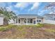 Wide view of the backyard with white fence and a covered patio at 378 Thistle Ln., Myrtle Beach, SC 29579