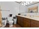 Functional bathroom featuring double sinks, wooden vanity, and tile flooring at 4612 Red Bluff Rd., Loris, SC 29569