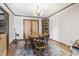 Elegant dining room with wooden table, chairs, chandelier, and corner cabinet at 4612 Red Bluff Rd., Loris, SC 29569