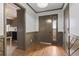 Welcoming entryway with wooden accents, hardwood floors, and a view into the kitchen at 4612 Red Bluff Rd., Loris, SC 29569