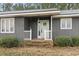 Charming entry with brick steps and a 'Welcome' wreath on the front door at 4612 Red Bluff Rd., Loris, SC 29569