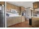 Functional kitchen featuring wooden cabinets, modern microwave, and hardwood floors at 4612 Red Bluff Rd., Loris, SC 29569