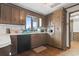 Charming kitchen with wooden cabinets, white subway tile backsplash, and a window over the sink at 4612 Red Bluff Rd., Loris, SC 29569