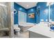 Modern bathroom with blue walls, a soaking tub, and a tiled shower at 4956 Dory Ct., North Myrtle Beach, SC 29582