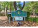 Elegant Tidewater Golf Club sign surrounded by lush landscaping, welcoming residents and guests at 4956 Dory Ct., North Myrtle Beach, SC 29582