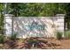 Attractive sign for Tidewater Golf Club & Plantation, set amid manicured landscaping, conveys prestige at 4956 Dory Ct., North Myrtle Beach, SC 29582