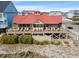 Beachfront exterior with spacious decks, offering stunning views and ample outdoor seating for guests at 4956 Dory Ct., North Myrtle Beach, SC 29582