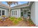 Inviting front entrance featuring decorative plants and a stylish glass-paneled door at 4956 Dory Ct., North Myrtle Beach, SC 29582