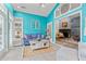 Cozy sunroom featuring colorful walls and an adjoining living room at 4956 Dory Ct., North Myrtle Beach, SC 29582