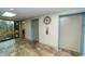 Hallway features flooring, elevators, a clock, and a scenic window at 5001 Little River Rd. # E-407, Myrtle Beach, SC 29577