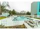 Community pool includes lounge chairs and trees in the background at 5001 Little River Rd. # E-407, Myrtle Beach, SC 29577