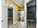 Inviting foyer with wood-look floors, neutral walls, and multiple doorways leading to various rooms at 5046 Belleglen Court # 101, Myrtle Beach, SC 29579