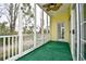 View of screened porch with outdoor ceiling fan and view of trees and neighboring house at 5046 Belleglen Court # 101, Myrtle Beach, SC 29579