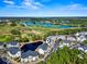 Aerial view of community with pond and golf course nearby at 5070 Windsor Green Way # 204, Myrtle Beach, SC 29579